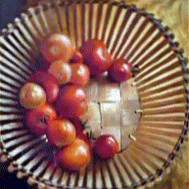 Painting of tomatoes in a basket